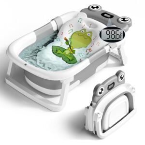A grey and white collapsible baby bathtub featuring a built-in digital thermometer and a floating green frog cushion for newborns.